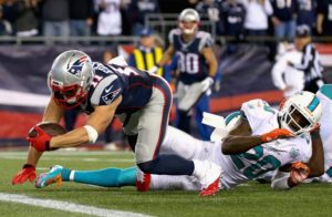 FOXBORO, MA - OCTOBER 29:  Julian Edelman #12 of the New England Patriots scores a touchdown during the fourth quarter against the Miami Dolphins at Gillette Stadium on October 29, 2015 in Foxboro, Massachusetts.  (Photo by Jim Rogash/Getty Images)