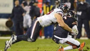 Nov 11, 2012; Chicago, IL, USA;  Houston Texans defensive end J.J. Watt (99) makes a tackle on Chicago Bears quarterback Jay Cutler (6) during the first quarter at Soldier Field. Mandatory Credit: Mike DiNovo-USA TODAY Sports